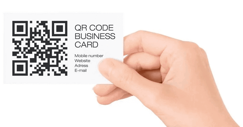 A traditional paper business card with a QR code